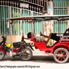 In Phnom Penh this is the equivalent of a taxi. Here's a driver taking a nap during the mid-day heat. Often tourists engage a tuk-tuk for the day, agreeing with the driver on a price and the number of and which sites he will drive them to that day.